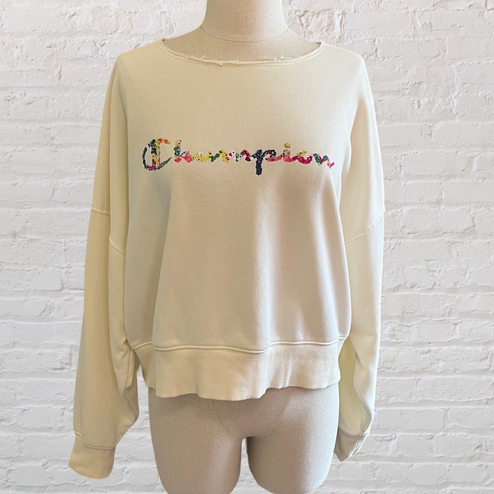 Cream Champion women's sweatshirt with floral design on lettering
